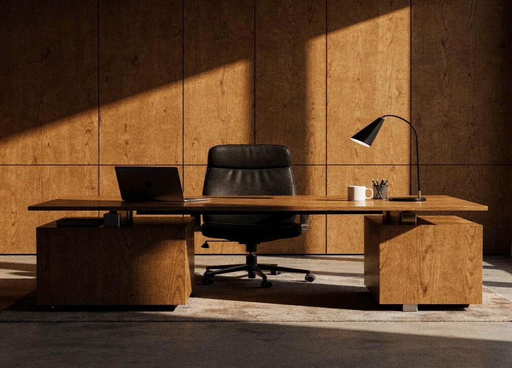 Modern office interior with timber panelling, desk and task lighting